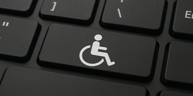 Bild einer Tastatur, auf deren Taste ein Rollstuhlsymbol zu sehen ist.